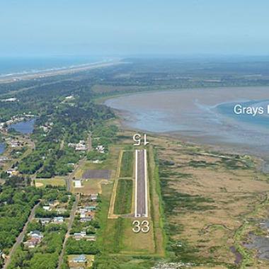 Ocean Shores airport runway with the beach to the right and town to the left.